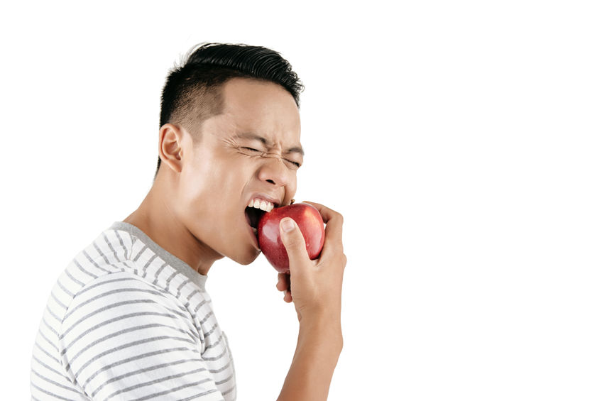 Man Biting Apple
